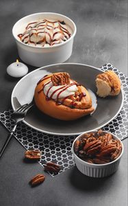 Preview wallpaper bun, nuts, cream, dessert, breakfast