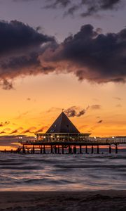 Preview wallpaper bungalow, pier, sunset, sea, sky