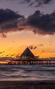 Preview wallpaper bungalow, pier, sunset, sea, sky