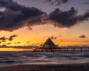 Preview wallpaper bungalow, pier, sunset, sea, sky