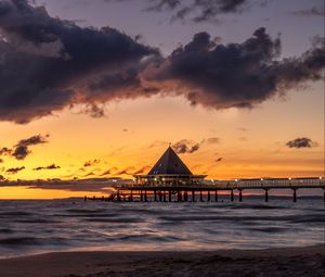 Preview wallpaper bungalow, pier, sunset, sea, sky