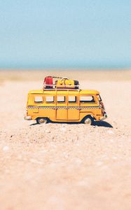 Preview wallpaper bus, toy, sand, beach, yellow