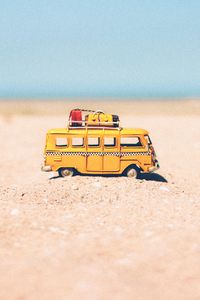 Preview wallpaper bus, toy, sand, beach, yellow