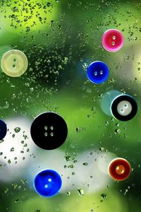 Preview wallpaper buttons, colorful, wet, surface