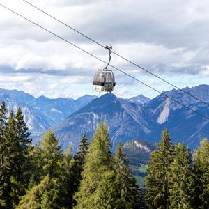 Preview wallpaper cabin, cable car, spruce, mountains, sky