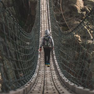 Preview wallpaper cable bridge, bridge, man, rocks