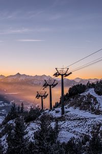 Preview wallpaper cableway, pillars, mountains, trees, sunrise, landscape