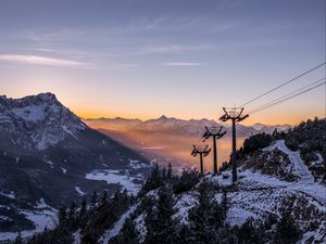 Preview wallpaper cableway, pillars, mountains, trees, sunrise, landscape