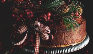 Preview wallpaper cake, branches, spruce, cones, bow, decoration