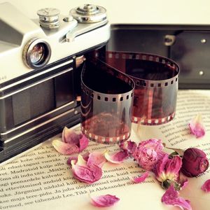 Preview wallpaper camera, film, books, flowers, dry, petals