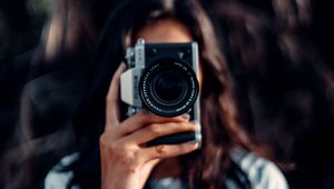 Preview wallpaper camera, girl, blur, focus