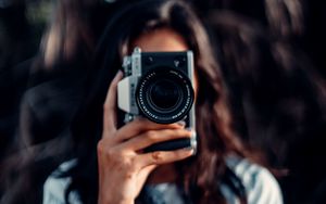 Preview wallpaper camera, girl, blur, focus