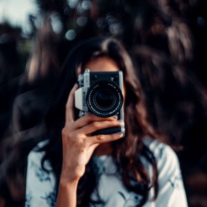 Preview wallpaper camera, girl, blur, focus