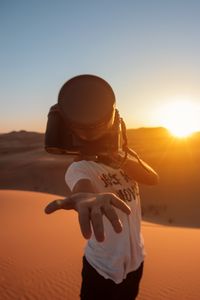 Preview wallpaper camera, hand, desert, sunlight