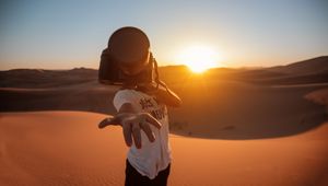 Preview wallpaper camera, hand, desert, sunlight