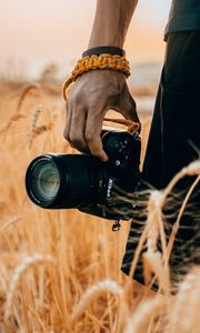 Preview wallpaper camera, hand, ears, photographer