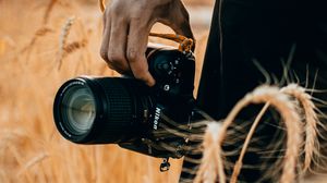 Preview wallpaper camera, hand, ears, photographer