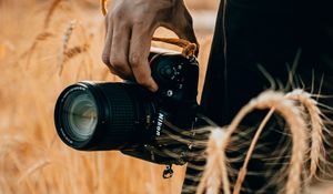 Preview wallpaper camera, hand, ears, photographer