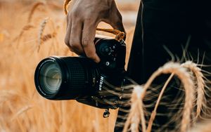 Preview wallpaper camera, hand, ears, photographer