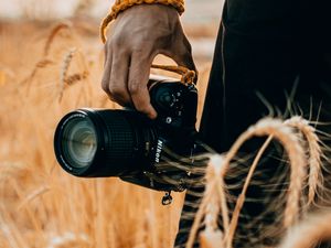 Preview wallpaper camera, hand, ears, photographer