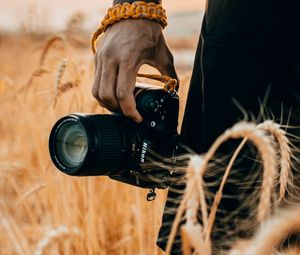 Preview wallpaper camera, hand, ears, photographer