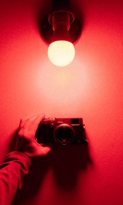 Preview wallpaper camera, hand, light bulb, light, red