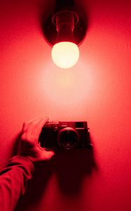 Preview wallpaper camera, hand, light bulb, light, red