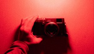 Preview wallpaper camera, hand, light bulb, light, red