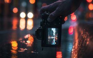 Preview wallpaper camera, hand, shooting, blur, neon