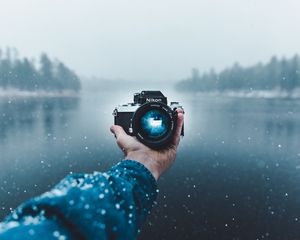 Preview wallpaper camera, hand, snow, lens