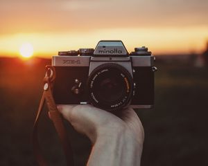 Preview wallpaper camera, hand, sunset, photographer
