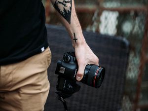 Preview wallpaper camera, hand, tattoo, photographer