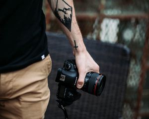 Preview wallpaper camera, hand, tattoo, photographer