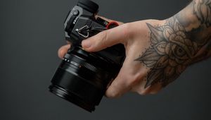 Preview wallpaper camera, hand, tattoo, black, photo