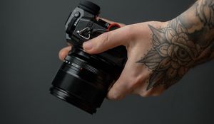 Preview wallpaper camera, hand, tattoo, black, photo