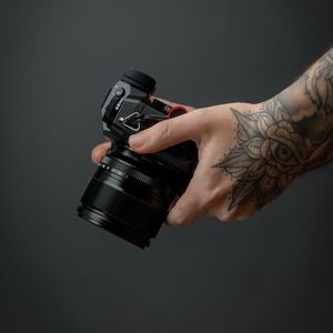 Preview wallpaper camera, hand, tattoo, black, photo