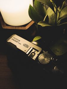 Preview wallpaper camera, lamp, plant