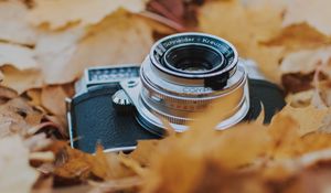 Preview wallpaper camera, leaves, foliage, dry, autumn