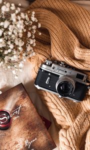 Preview wallpaper camera, lens, flowers, book, cloth