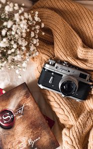 Preview wallpaper camera, lens, flowers, book, cloth