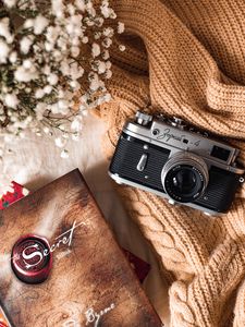 Preview wallpaper camera, lens, flowers, book, cloth