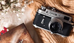 Preview wallpaper camera, lens, flowers, book, cloth