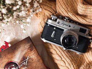 Preview wallpaper camera, lens, flowers, book, cloth