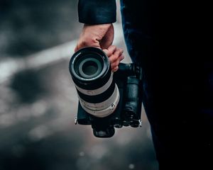 Preview wallpaper camera, lens, hand, focus