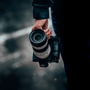 Preview wallpaper camera, lens, hand, focus
