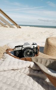 Preview wallpaper camera, lens, hat, beach