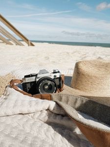 Preview wallpaper camera, lens, hat, beach
