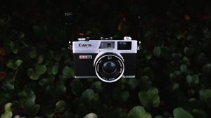 Preview wallpaper camera, lens, objective, retro, leaves, bush