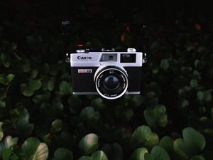 Preview wallpaper camera, lens, objective, retro, leaves, bush