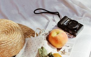 Preview wallpaper camera, peaches, fruit, magazine, fabric